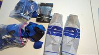All items including Genutrain knee braces and multiple wrist braces/supports shown on white surface
