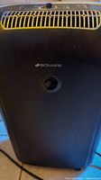 Front view of black Bionaire dehumidifier showing brand logo and air vent grill.
