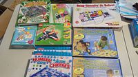 Photo showing educational kits including Snap Circuits Jr., LEGO Creator sets, alphabet & number puzzles, and teacher games still in original packaging.