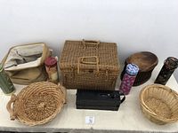 Overview of all items including wicker baskets, fabric-lined basket, metal containers
