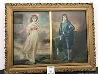 Framed pictures of a boy and a girl in vintage classical style in a gold ornate frame.