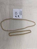 Two gold plated rope style necklaces, one 24 inches long and one 14 inches long with seller's size note.