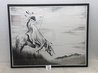 Frontal image showing the entire framed pencil sketch of a Native American man on horse in a landscape setting with mountains in the background.