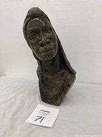 Front and side view of the Shona female bust sculpture in green verdite stone, showing detailed facial features and textured necklace.