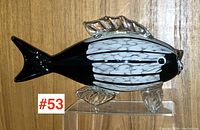 Front view of the large art glass fish sculpture showing the pattern and clear fins