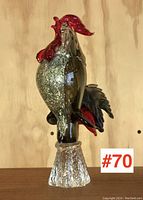 Front view of art glass rooster sculpture showing red comb, textured clear glass base, and iridescent body with sparkle inclusions
