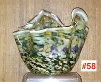 Front view of large spatter glass 'fazzoletto' vase showing ruffled top edge and multicolor speckled pattern.