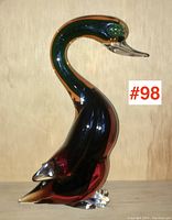 Side profile of the Murano glass duck showing its layered sommerso coloring and applied feet.