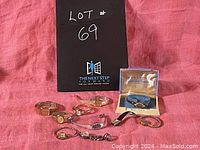 Lot of nine ladies wristwatches displayed on a red cloth, one in original Bulova box.