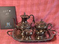 Full view of silver plate coffee and tea set on tray showing all five pieces including coffee pot, tea pot, creamer, sugar bowl, and serving tray.