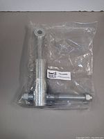 Steel latch assembly in sealed plastic bag showing hardware parts and Buyers product label.