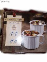 Photo of the CorningWare French White 8-piece Remington set box showing the product image with 4 mugs and 4 ramekins with lids.