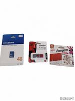 Photo showing 4GB Easystore SDHC card, Kingston 8GB USB stick and pack of Energizer batteries arranged side by side.