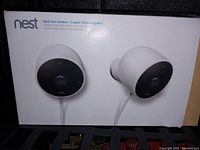 Front of the Nest Cam Outdoor 2-pack product box showing two cameras and model branding