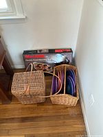 Full view including the Maxim electric food warming tray box, large wicker basket with leather clasp and handle, and smaller wicker basket with plate holders.