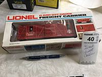 Lionel freight horse carrier train car in original box with plastic horses inside, labeled with MaxSold tag #40