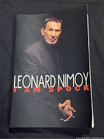 Front cover of the book showing Leonard Nimoy in a black suit with 'LEONARD NIMOY I AM SPOCK' title.