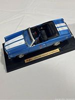 Top view of blue Maisto 1971 Chevrolet Chevelle SS454 convertible diecast model on black display base showing interior and exterior detail.