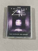 Front cover of the DVD case showing the Twilight Zone logo and purple window artwork.