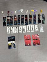Overall view of all Star Trek items including bookmarks with tassels, caricature cards, promo booklets, and hologram collectible card.