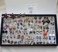 Full tray of 44 pairs of assorted vintage earrings with various designs and materials.