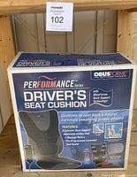 Photo of original box with branding, features, and product image of ObusForme Performance Driver's Seat Cushion.