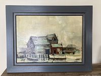 Frontal image of the full painting showing the fishing shack, boats, water, and surrounding scene in muted colors with a gray frame.