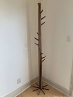 Full-height view of rack against wall showing central column and base