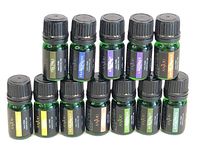 12 bottles of Anyou branded 100% essential oils each in green glass bottles with black caps and black labels; the scents visible include Lemongrass, Bergamot, Eucalyptus, Lavender, and others.