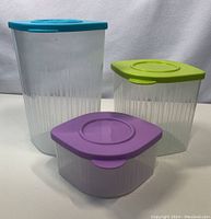 Photo showing the three Tupperware Fresh n’ Cool containers arranged side by side with lids on, from the front view.