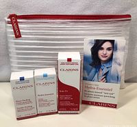 Lot contents and travel pouch with included mini skincare products and informational leaflet