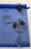 Crystal Art suncatcher featuring a wire-wrapped Tree of Life with colorful crystal chips, clear faceted pendant, and blue gift pouch.