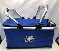 Blue insulated cooler bag showing front with "9 Dave" logo and aluminum handles.