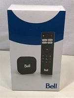 Front of the sealed Bell streaming media player box showing device and remote images with Bell branding and streaming service buttons.