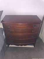 Front view of dresser showing all four drawers and overall condition