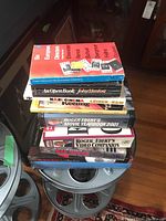 Stack of movie books showing several titles and sizes, some hardcover and some paperback.