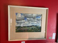 Frontal view of the framed watercolour landscape painting showing the overall artwork and the frame with visible wear.