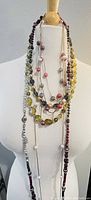 Lot of 5 different women's bead necklaces displayed on a mannequin showing various bead colors and styles
