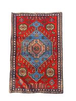 Full top view of Ardebil small wool rug mat showing geometric and floral traditional motifs in natural red, blue, beige and earth tones.
