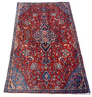Full view of rug on white background showing entire pattern and colors