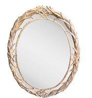 Oval mirror with an intricate whitewashed palm leaf frame on a white background.