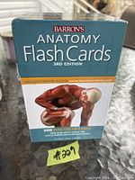 Box of Barron's Anatomy Flash Cards, 3rd Edition, showing front with illustration of human muscles.