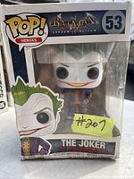 Front view of Funko Pop! figure box showing The Joker figure and box details with age wear on box.