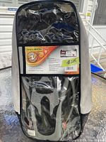 Swimming fins inside the carrying case showing U.S. Divers label and specifications including size information (43-45).