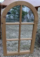 Front and angled views of the cathedral-shaped 6 pane mirror with pine wood frame outdoors showing condition and details