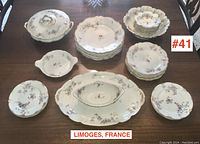 Overall arrangement of full dinner service set, including plates, serving pieces and extras