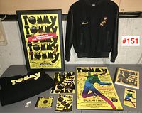 Full lot overview showing posters, jacket, t-shirt, CD, script, and keychain.