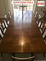 Table fully extended seen from above with chairs around