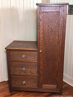 Front and side view of wooden cabinet showing three drawers with glass knobs and adjacent side door with matching knob.