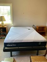 Overall view of assembled mattress and frame in room